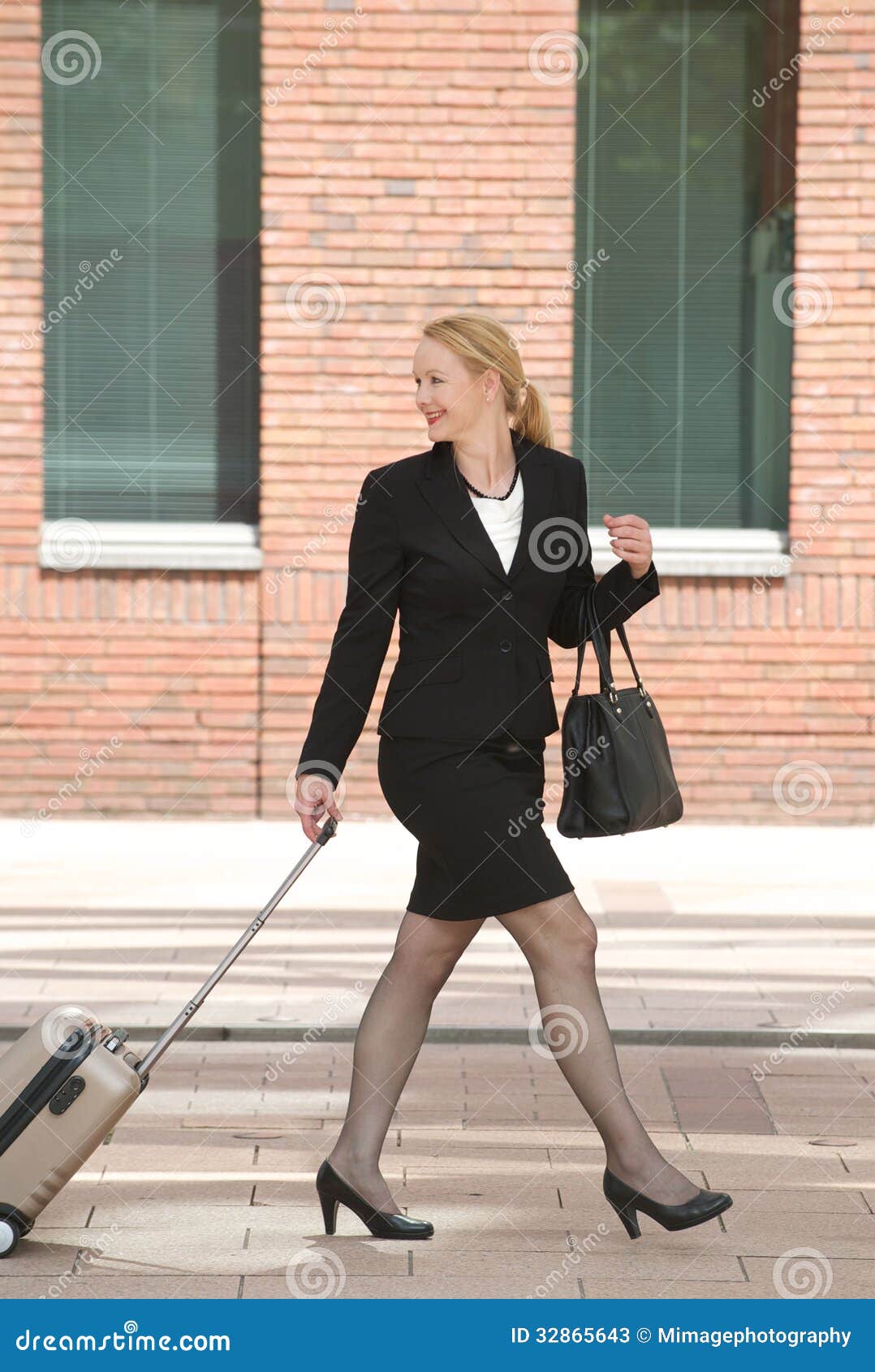 Business Woman Walking With Travel Luggage In The City Stock Photos ...