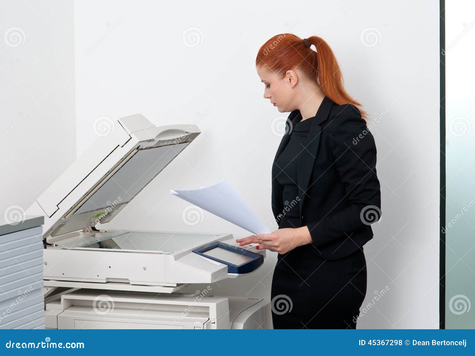 business woman working on office printer