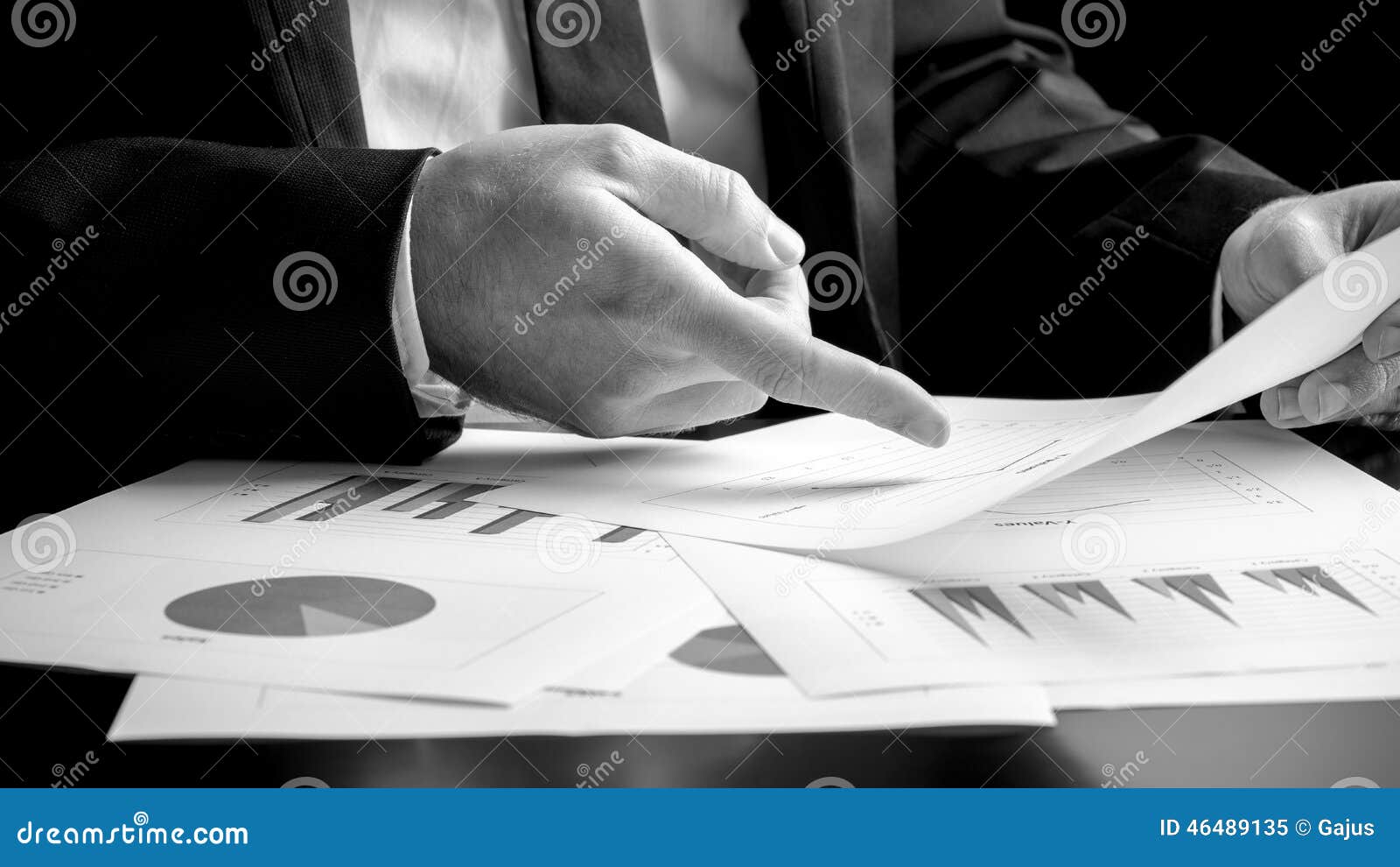 businessman analysing a set of graphs