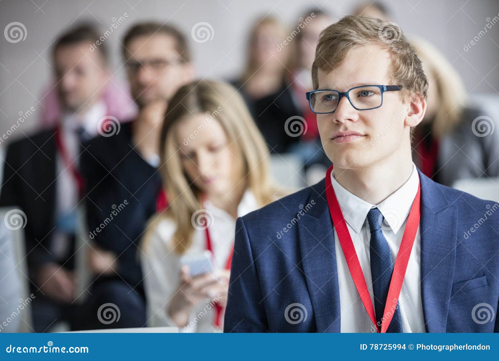 businessman attending seminar in convention center