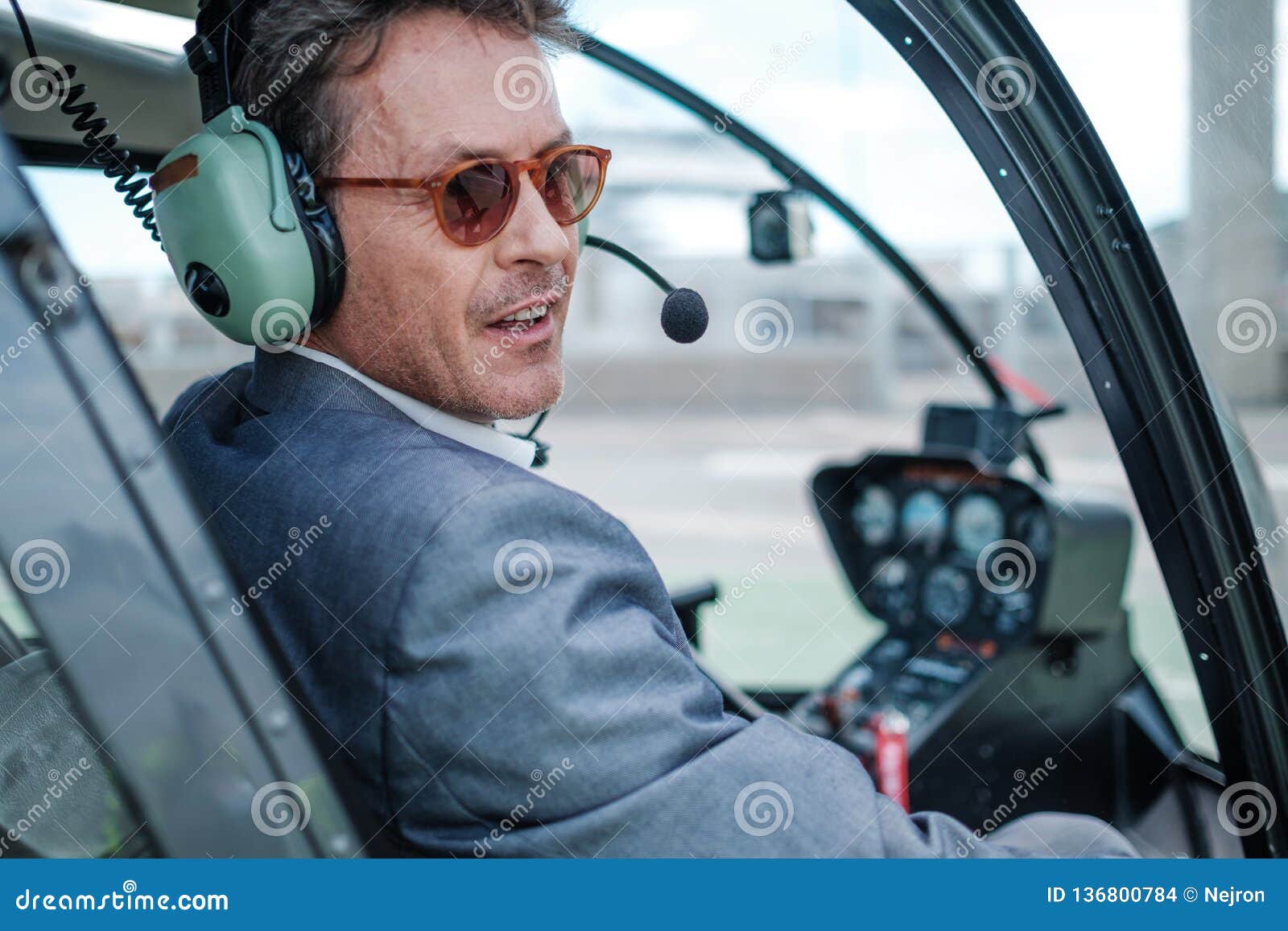 Businessman Behind Steering Wheel of His Helicopter Stock Photo Image