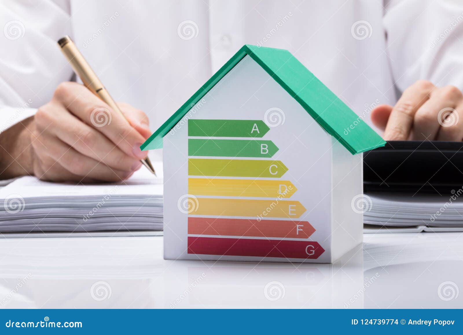 businessman calculating energy efficient house