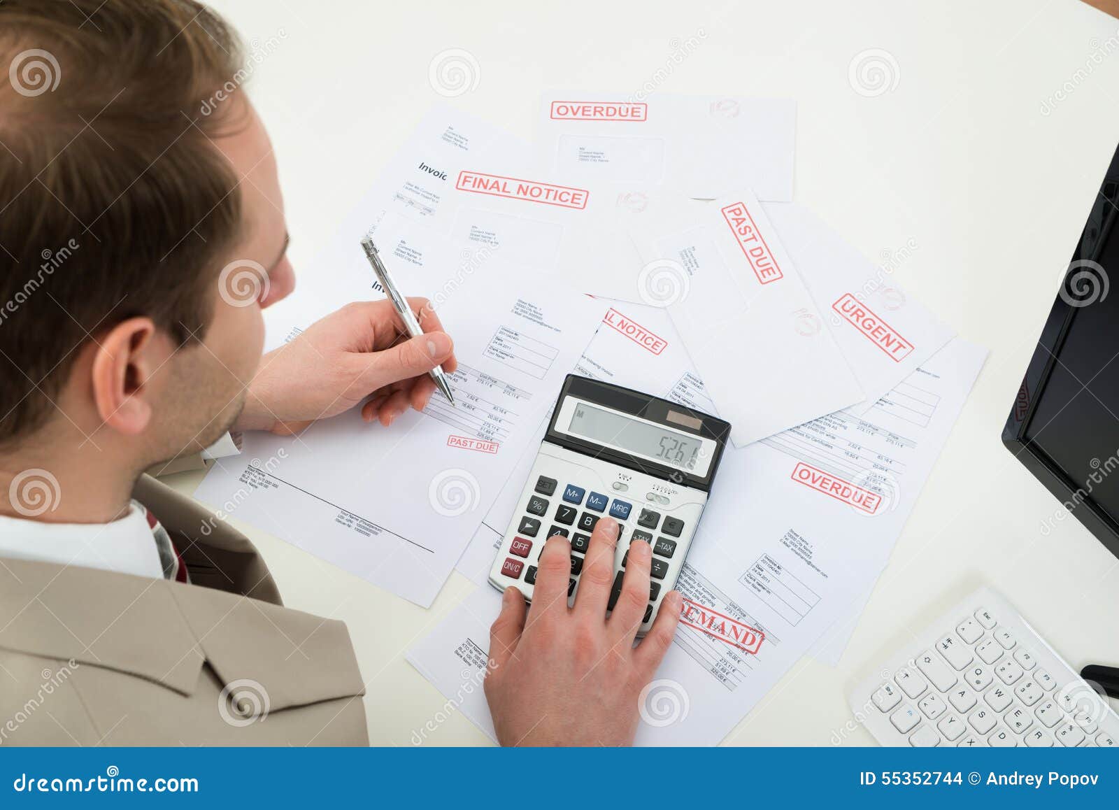 businessman calculating financial bills