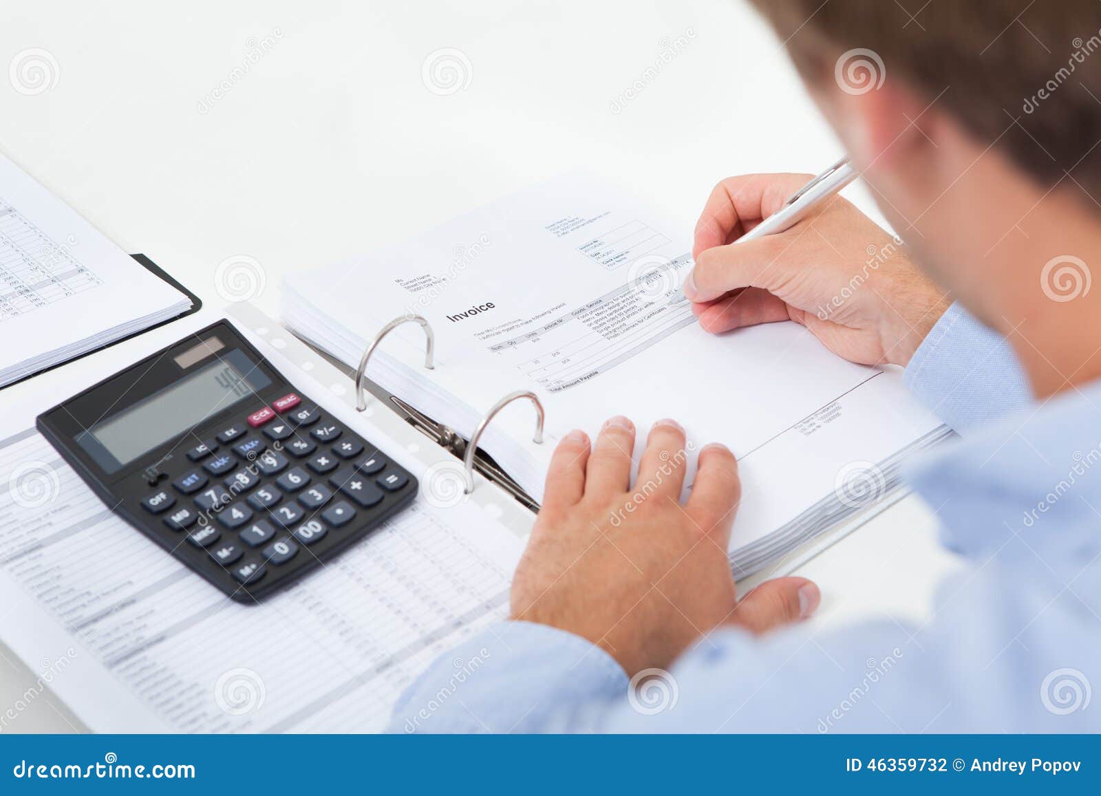 businessman calculating tax in office