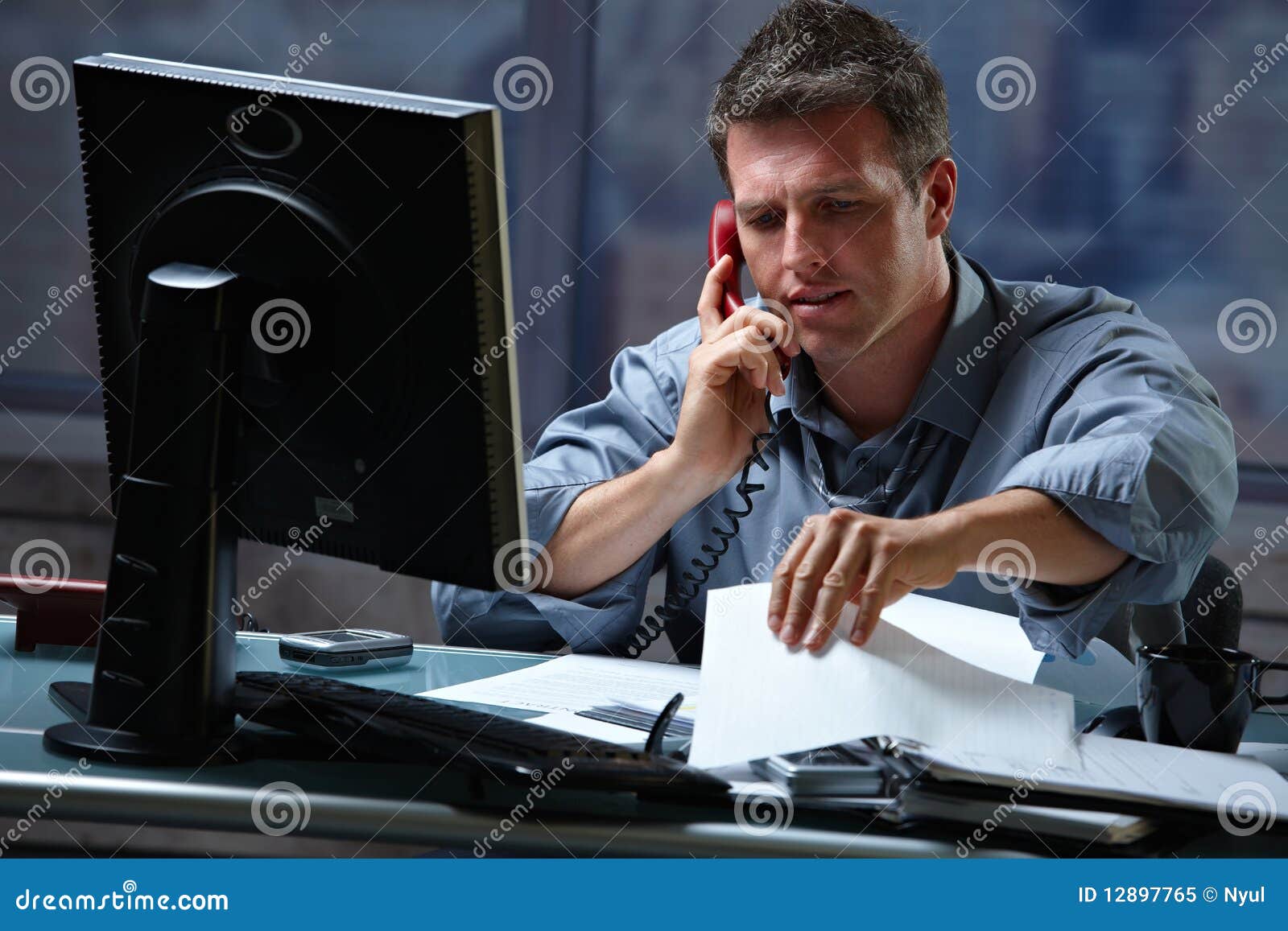 businessman on call in overtime