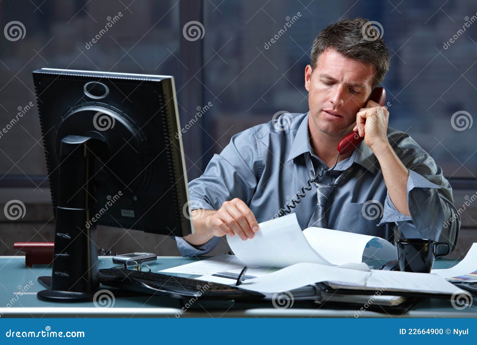 businessman on call in overtime