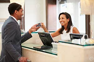 Reception Of Hotel Desk Clerk Taking A Call Stock Image 