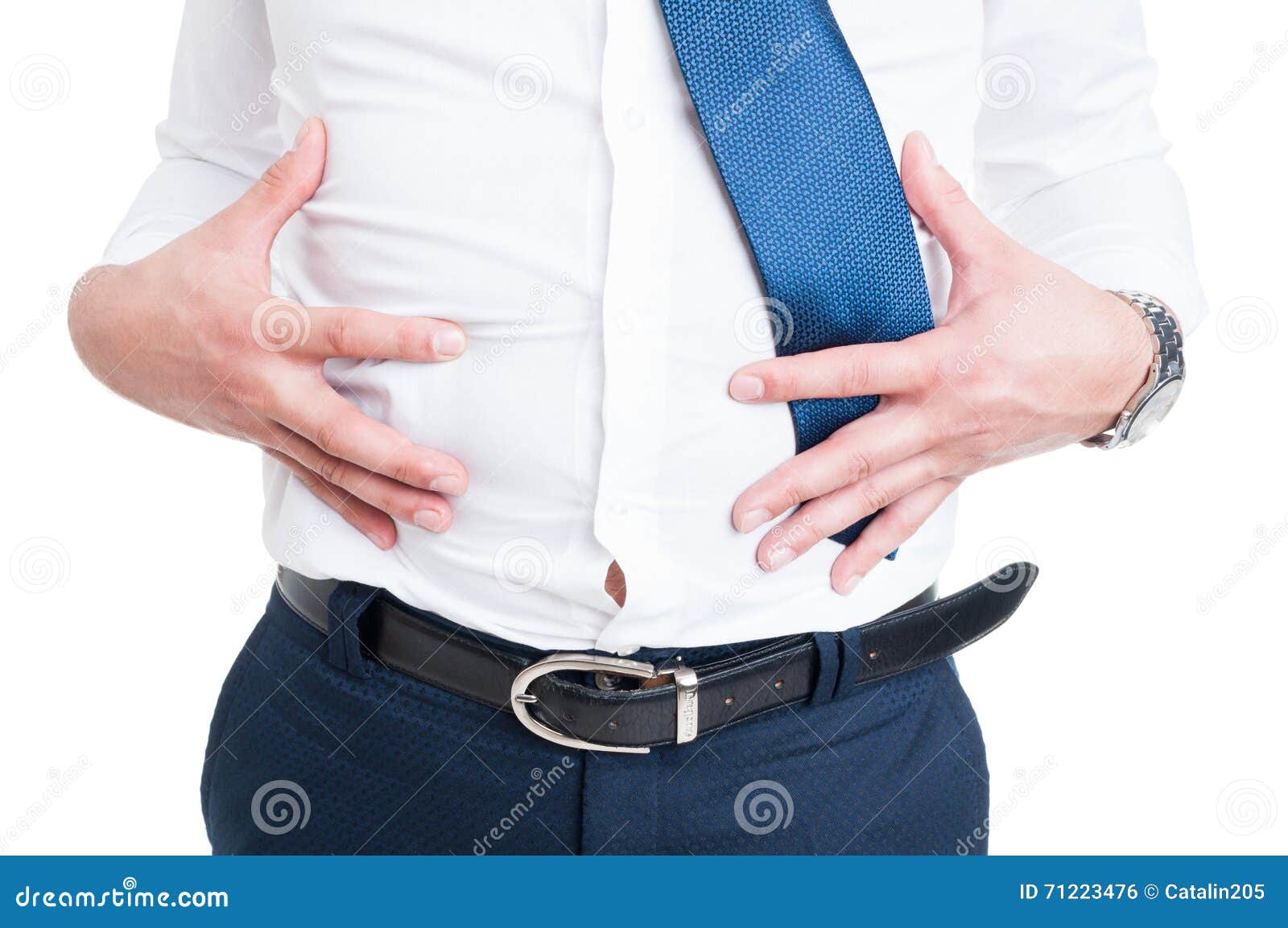 businessman in closeup holds his stomach because of bloating