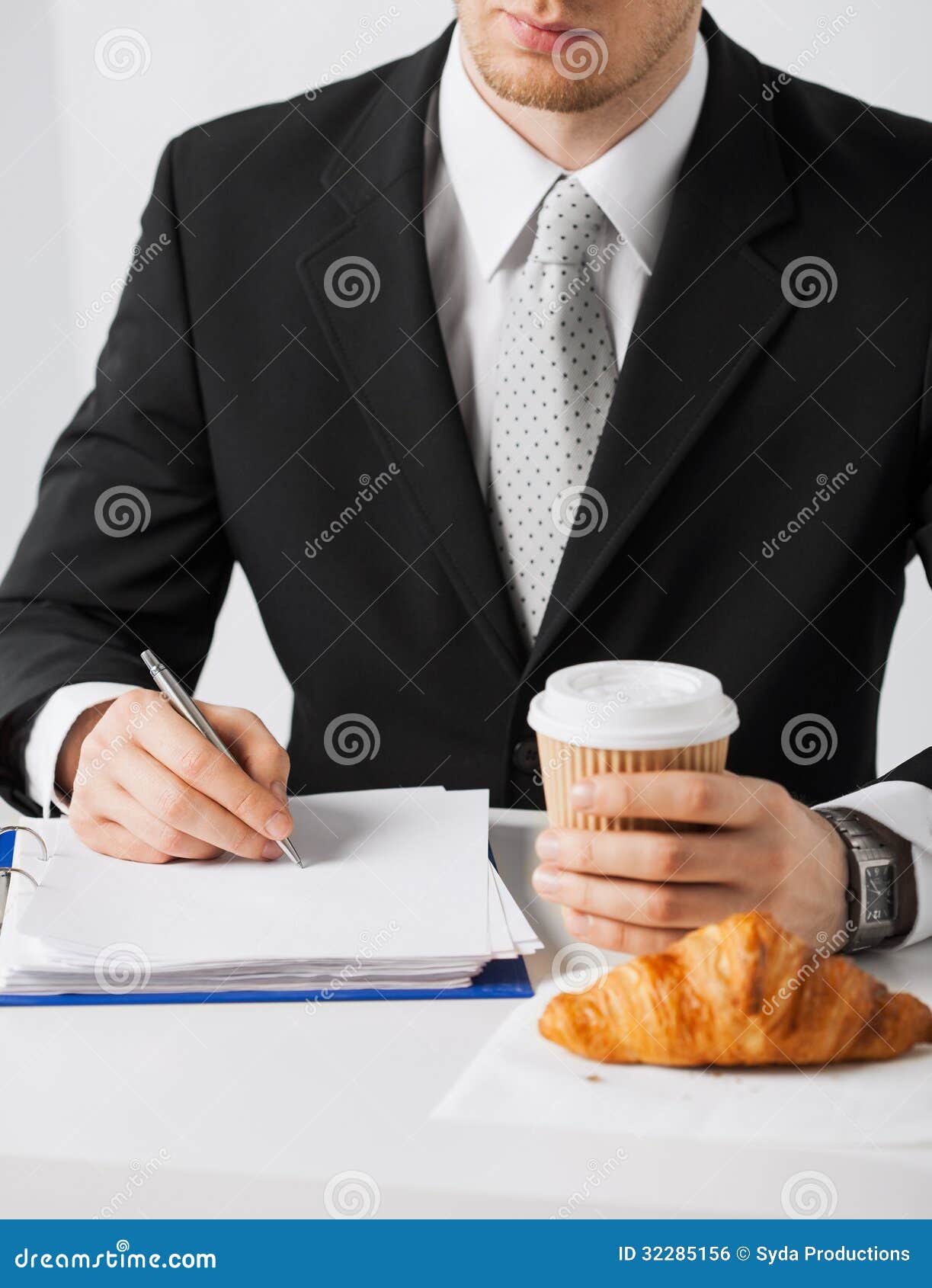 Businessman with Coffee Writing Something Stock Photo Image of notes, empty 32285156