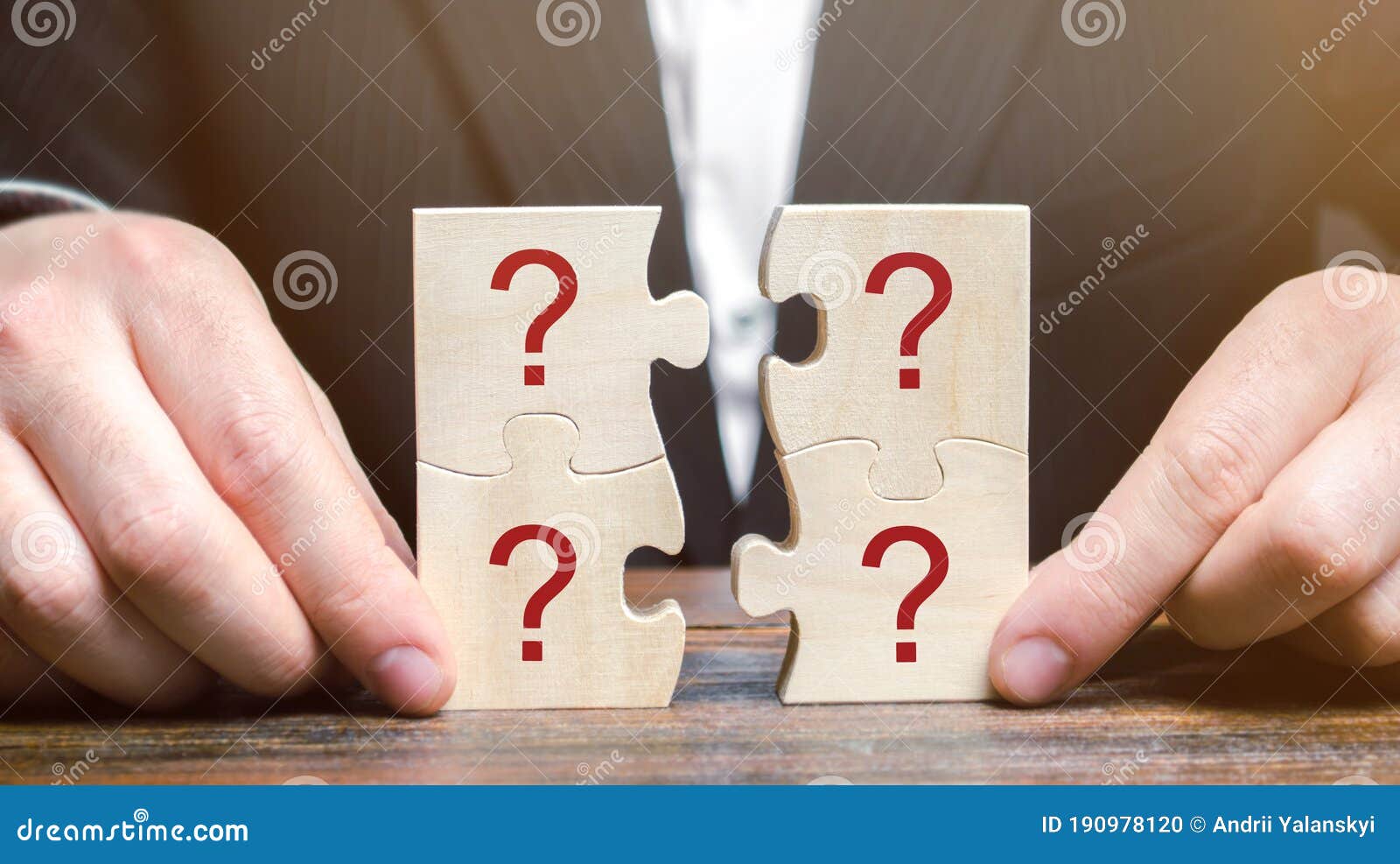 Businessman Collects Puzzles with Question Marks. Asking Questions ...
