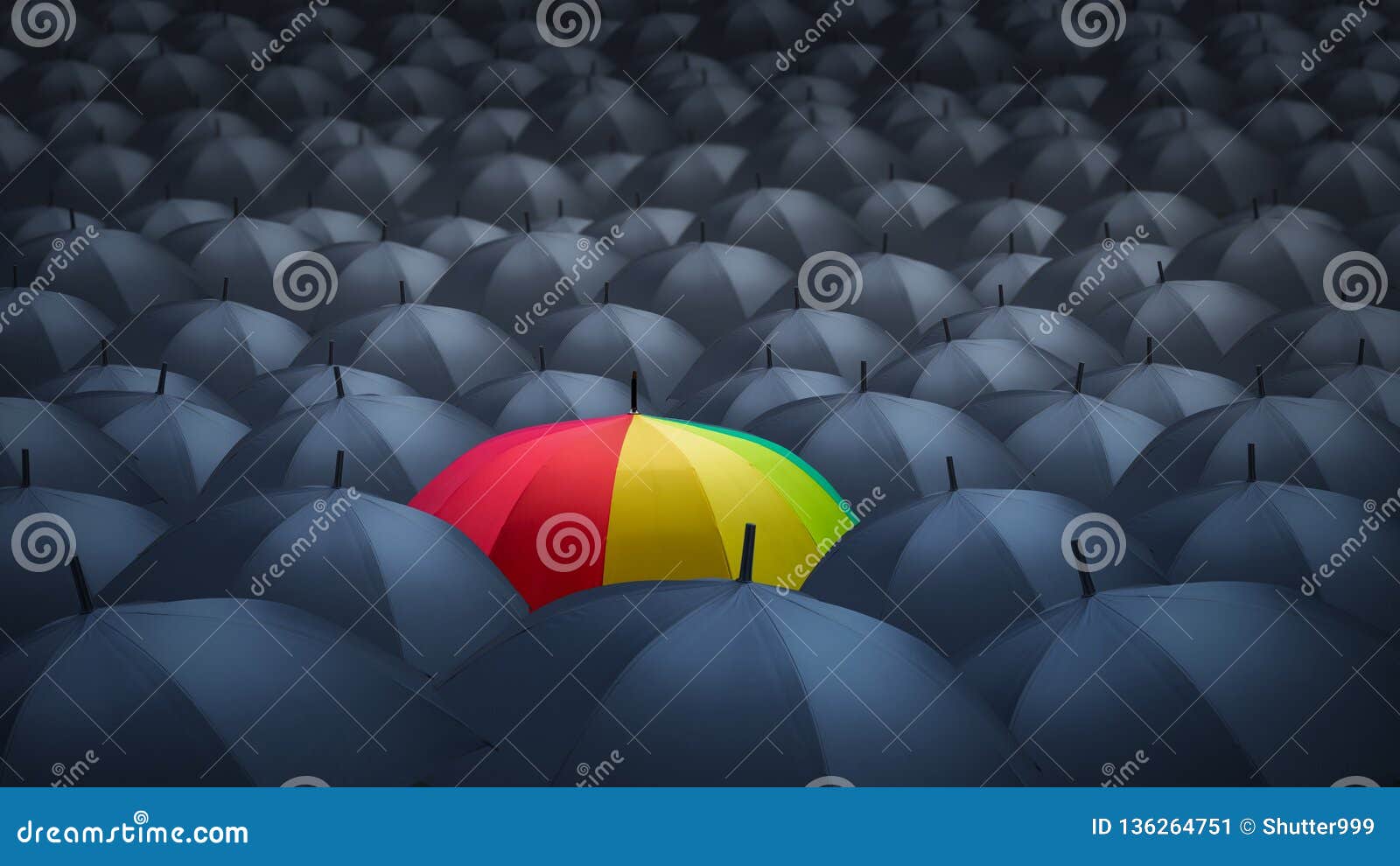 businessman with colorful rainbow umbrella among others, unique