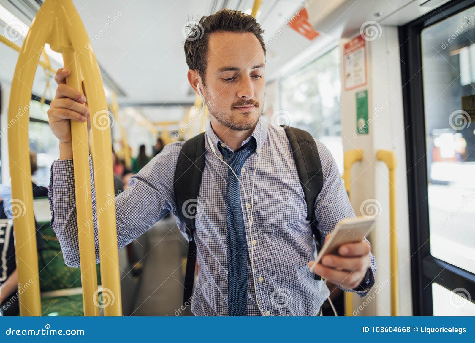 businessman commuting by tram in melbourne