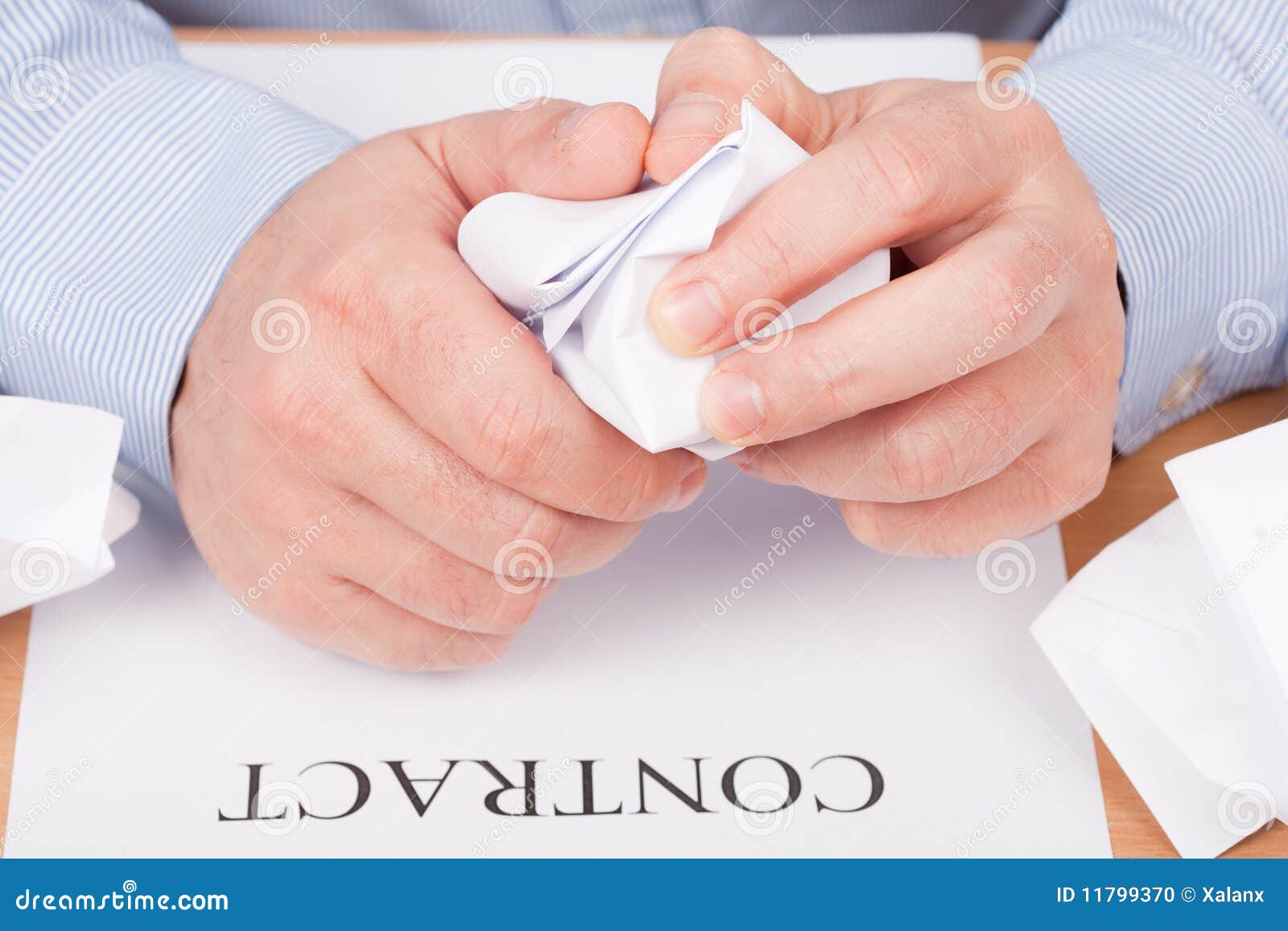 businessman crumpling documents