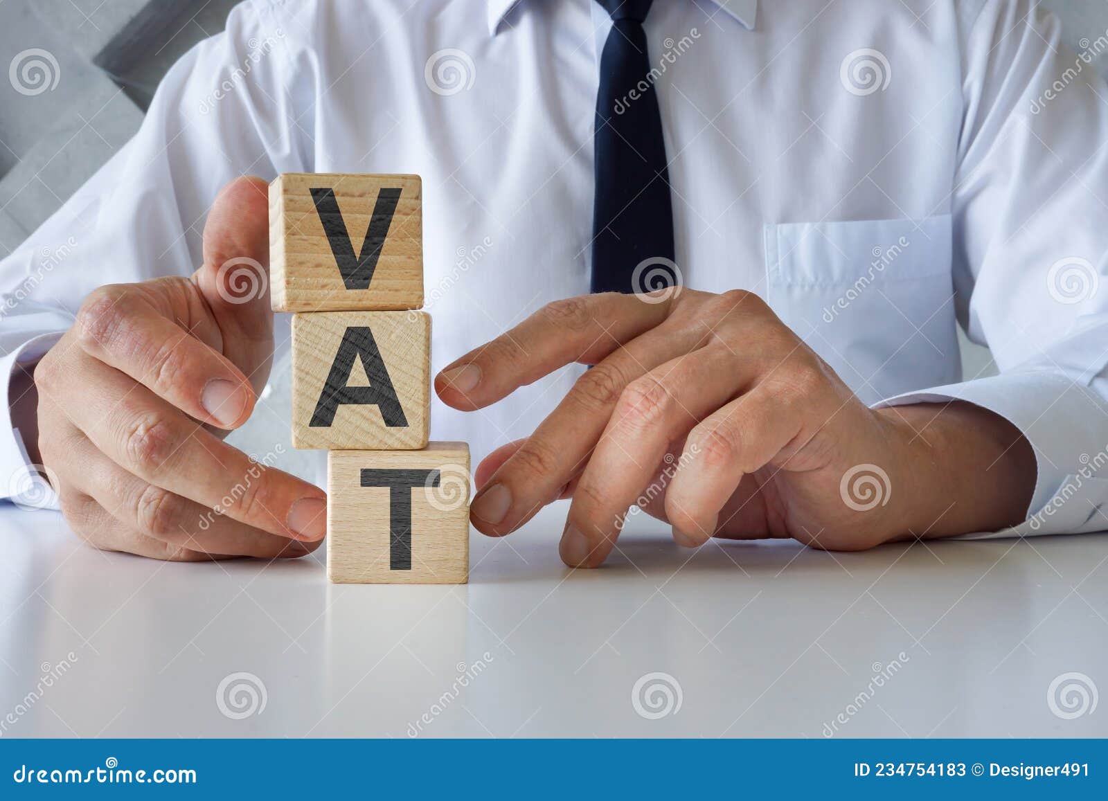 businessman with cubes vat or value added tax.