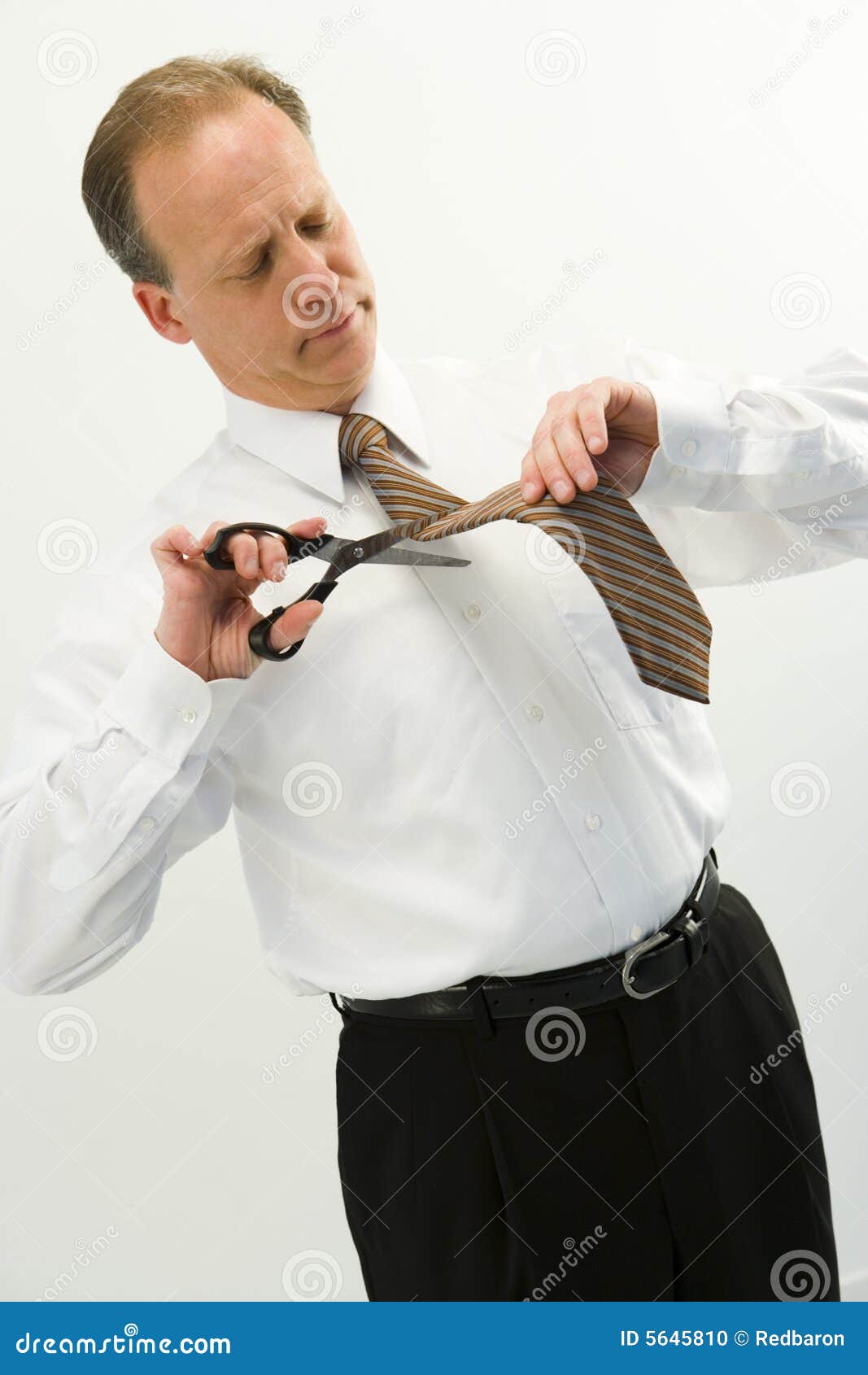 Businessman Cutting Tie stock photo. Image of businessman 5645810