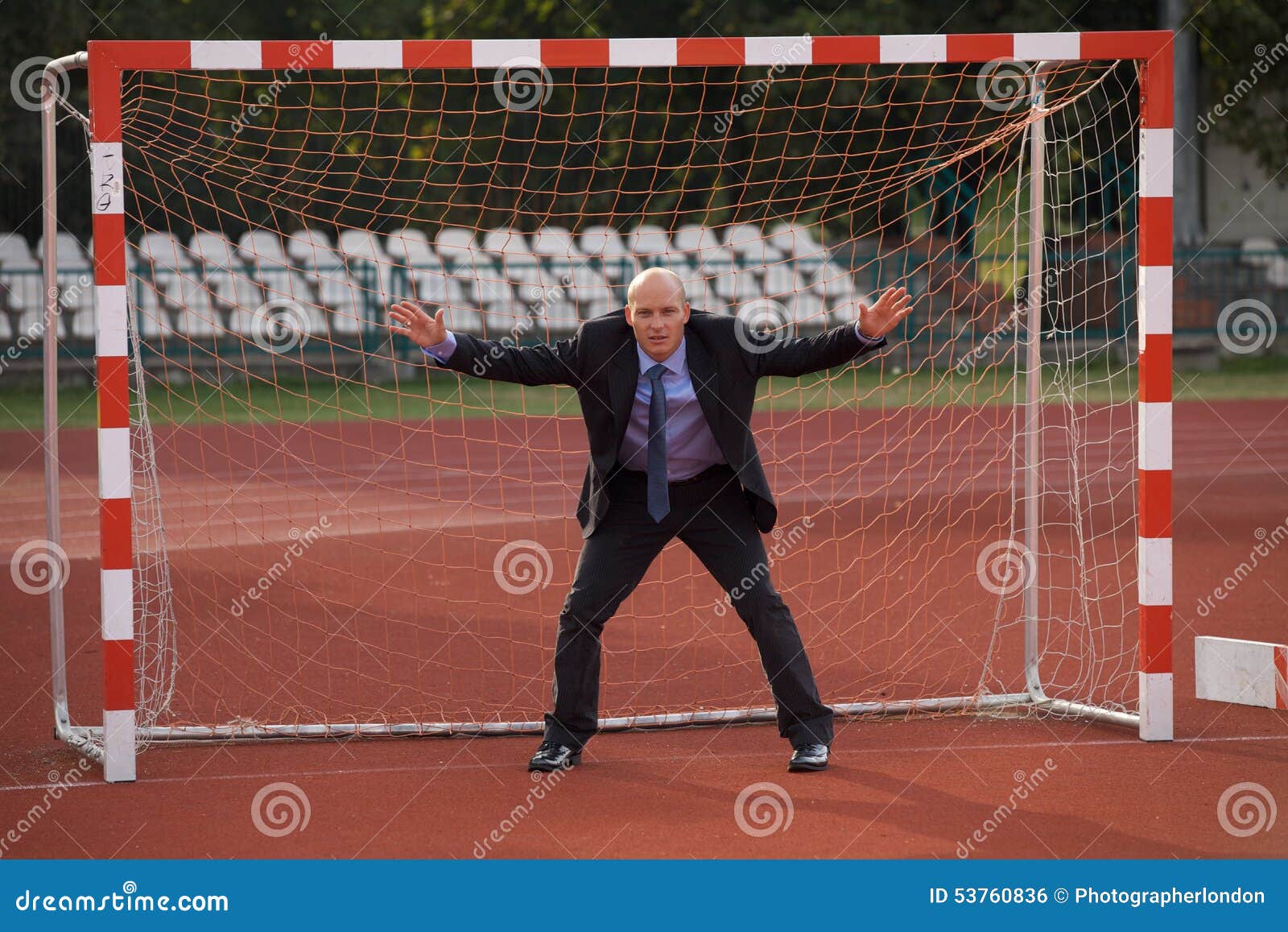 businessman defending goal