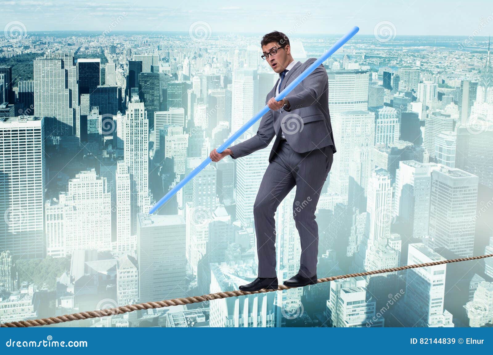 The Businessman Doing Tightrope Walking in Risk Concept Stock Image