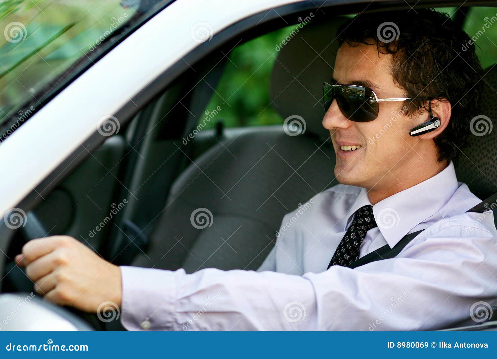 Businessman Driving with Bluetooth Stock Image - Image of bluetooth, driving:  8980069
