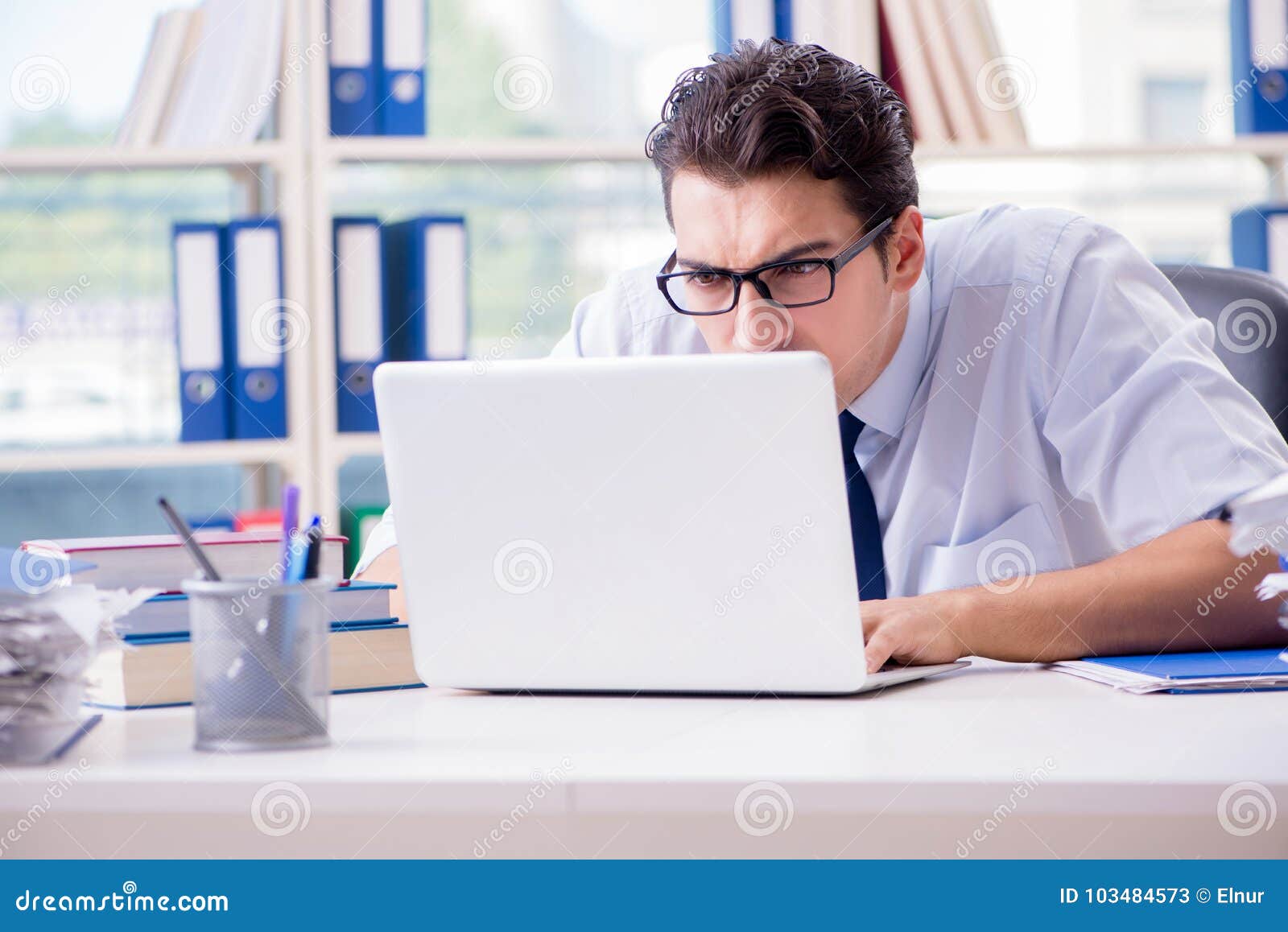 The Businessman with Excessive Work Paperwork Working in Office Stock