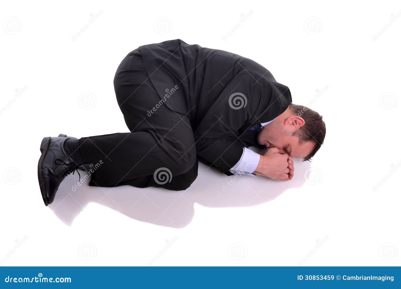 businessman in fetal position