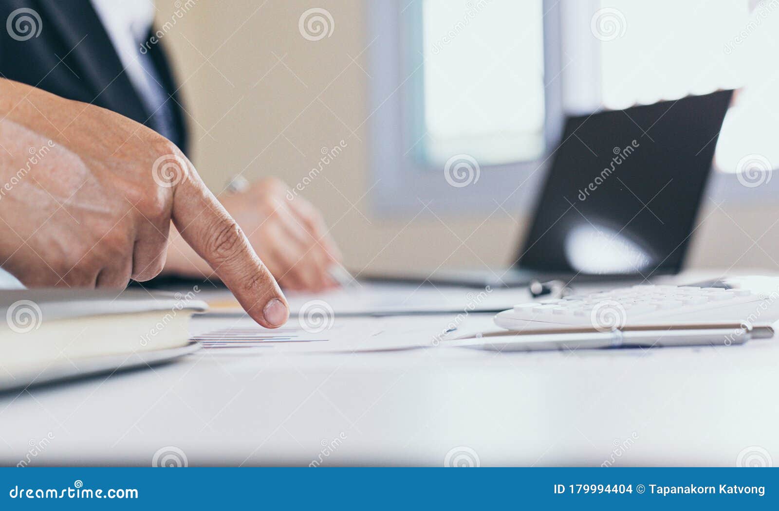businessman and financial team are analyzing the results of operations and calculating the company`s revenue and expenses in orde