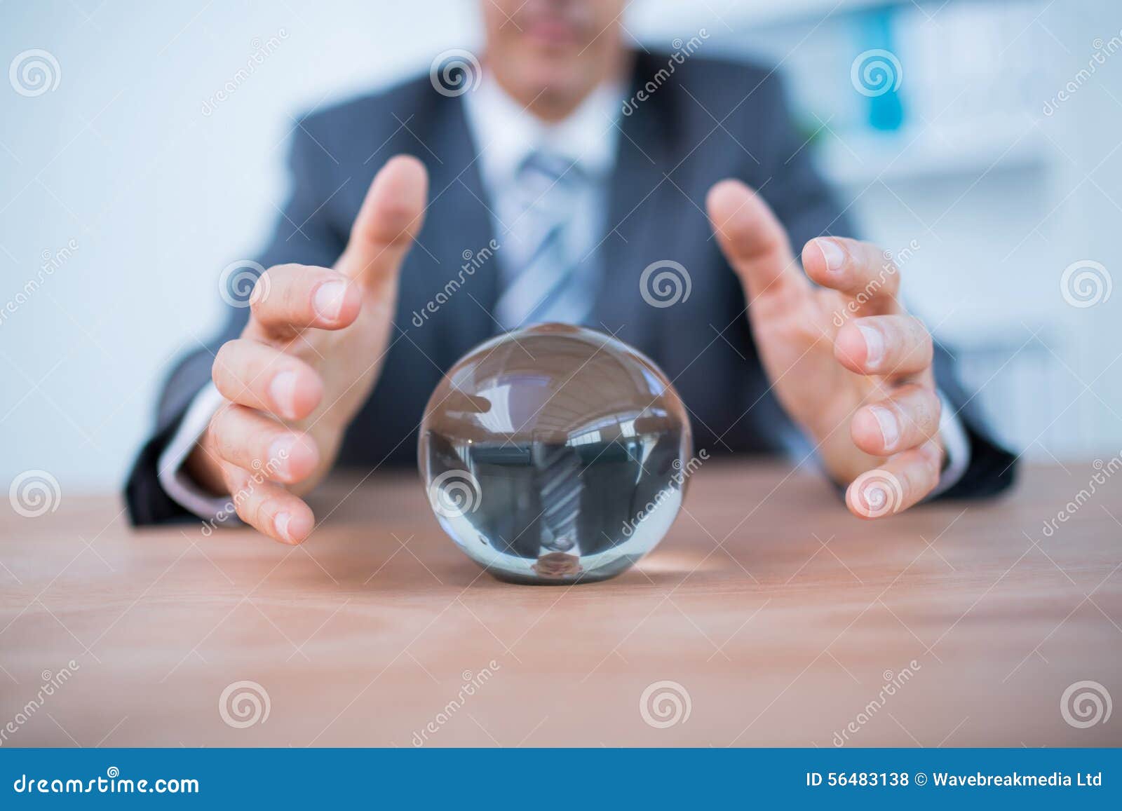 businessman forecasting a crystal ball