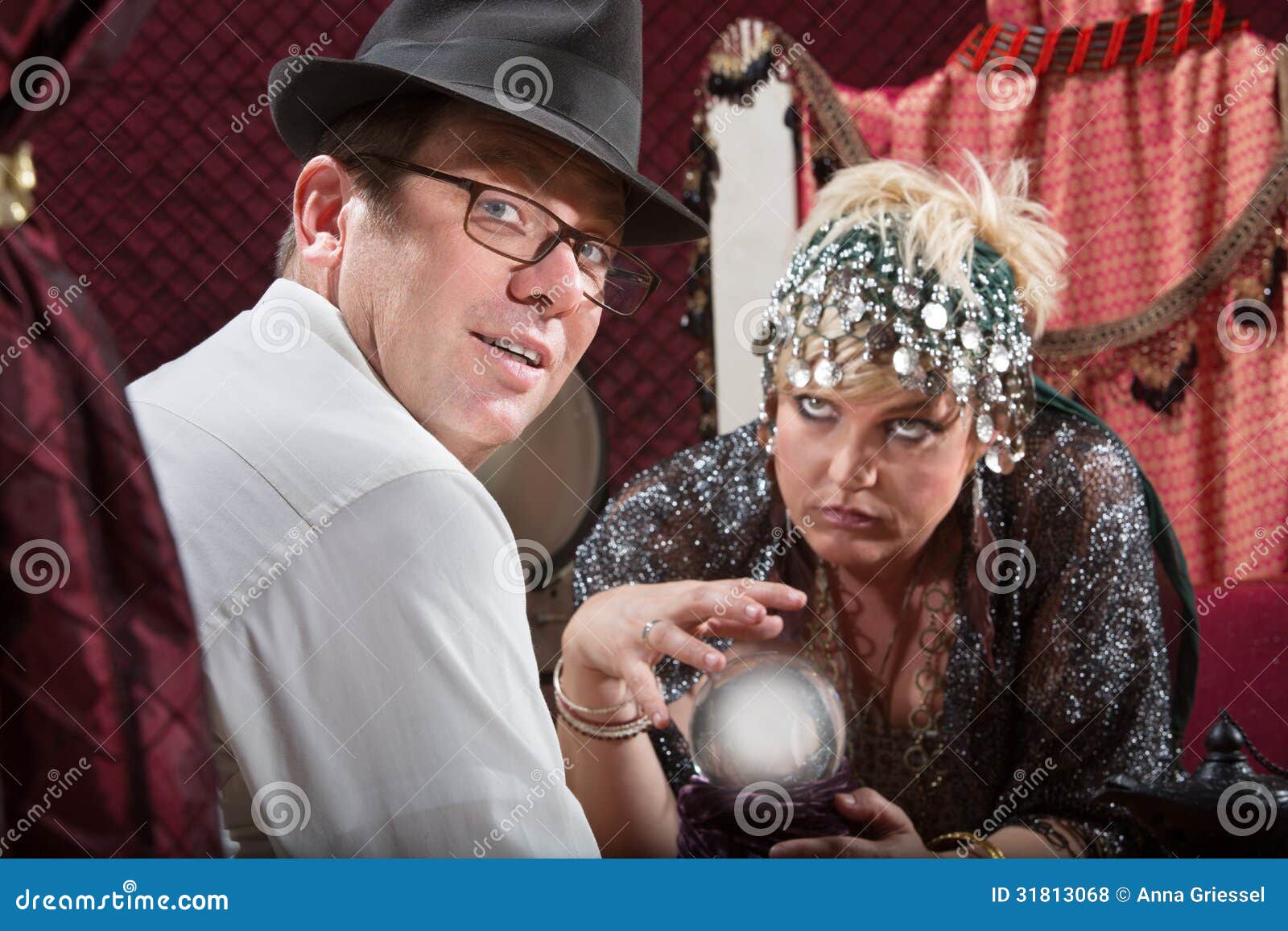 Businessman with Fortune Teller. Businessman with eyeglasses with crystal ball fortune teller