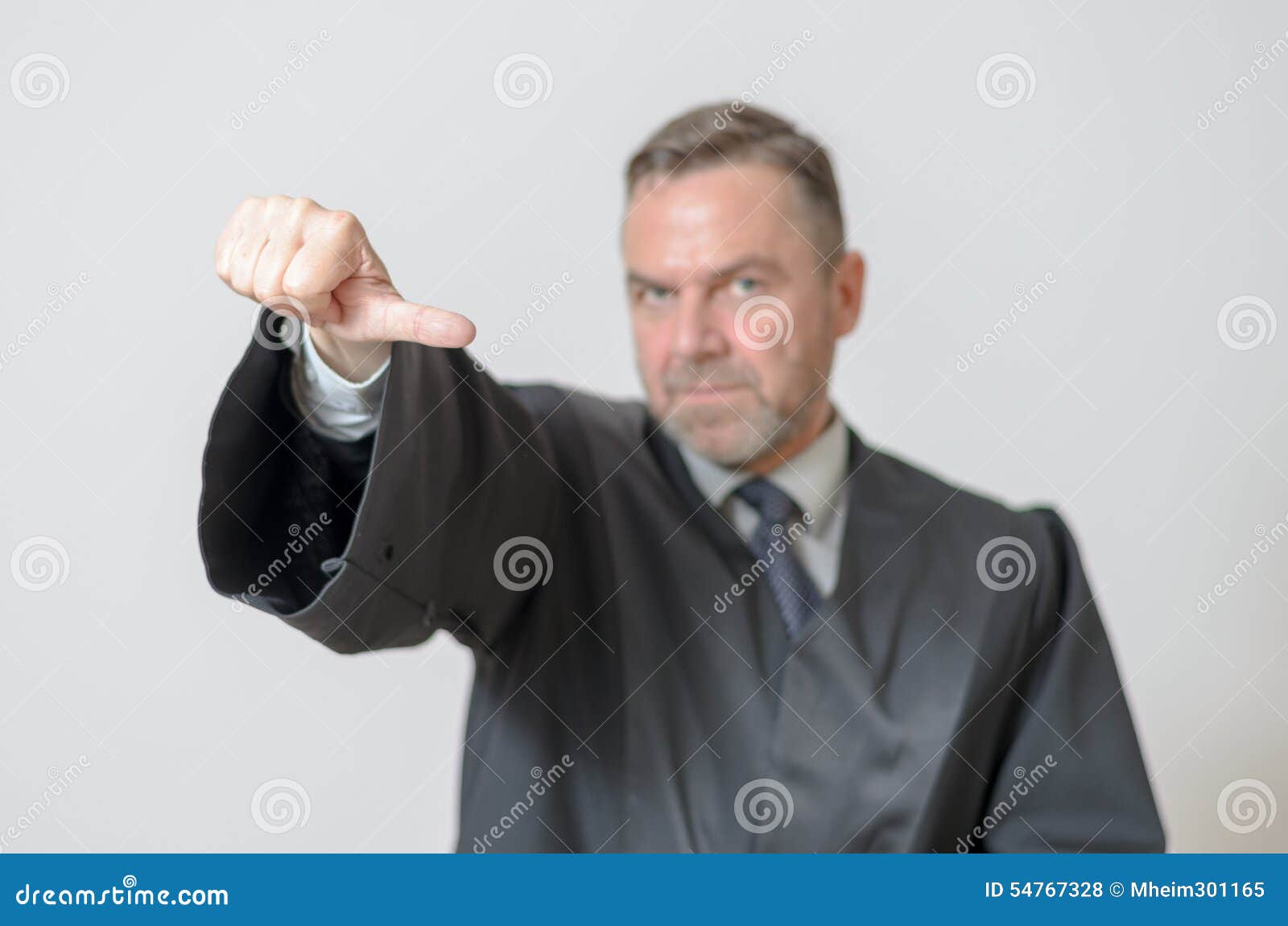 businessman giving a thumbs to side gesture