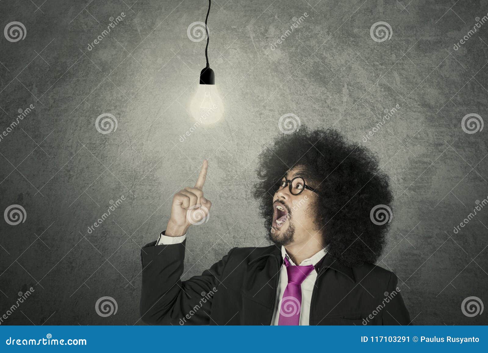 businessman with glowing light bulb