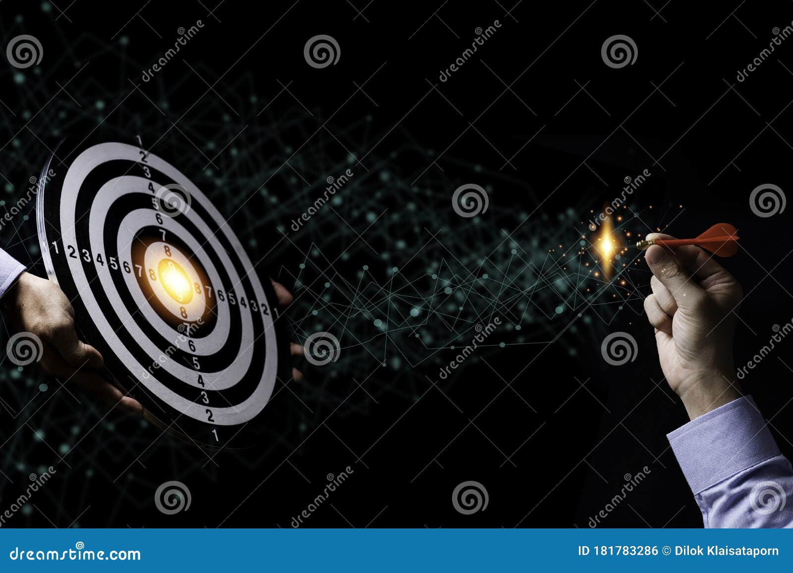 businessman hand throw red arrow dart to target board. business investment target 