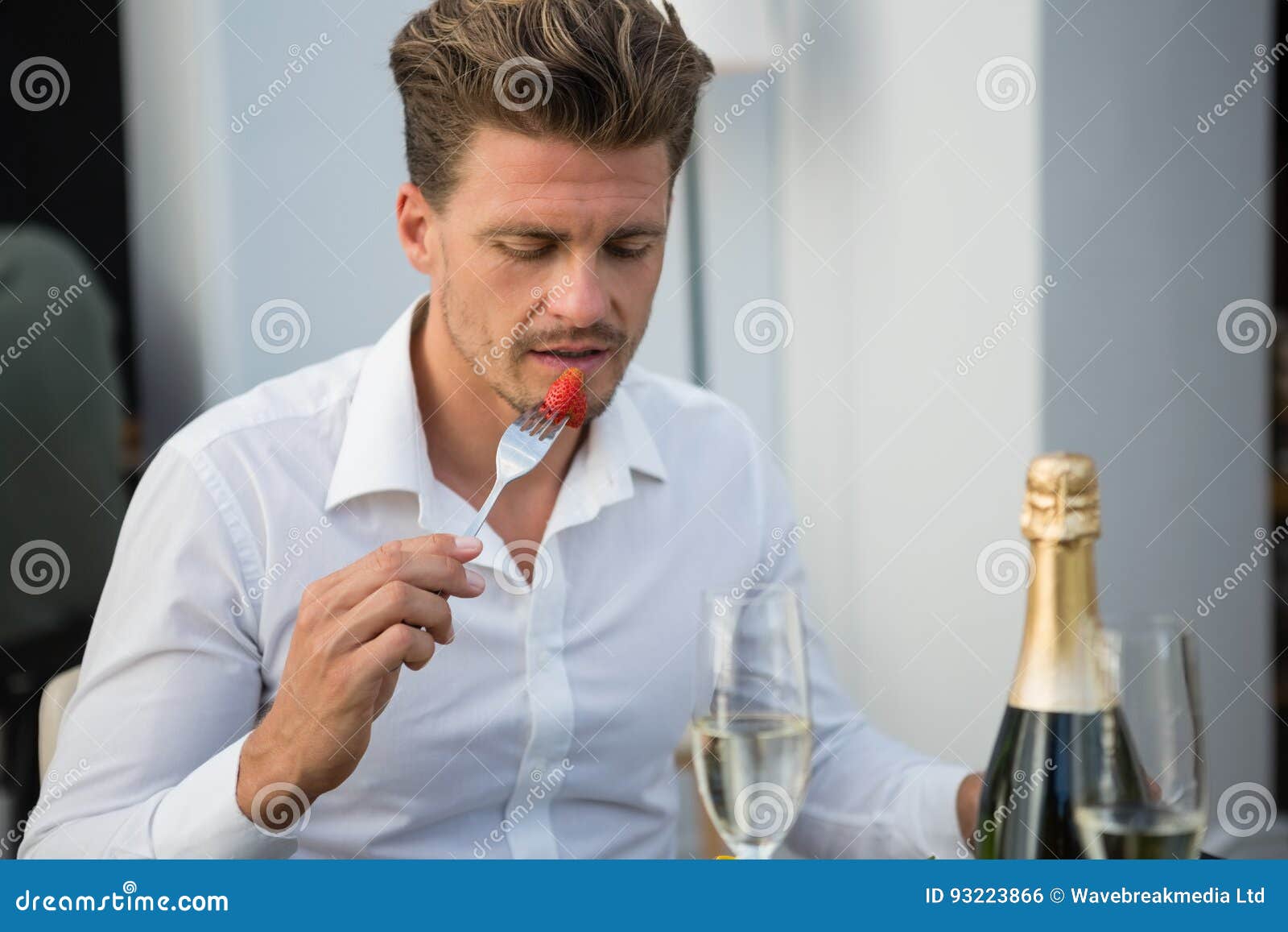 Businessman Having Strawberry in Restaurant Stock Photo - Image of