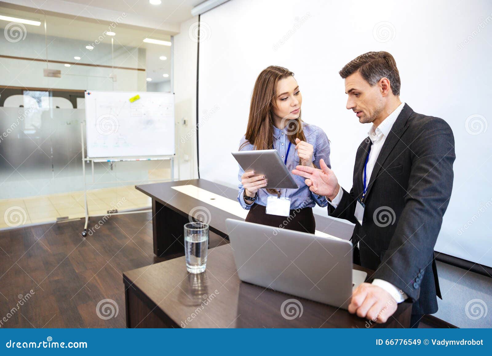 Businessman and His Secretary Planning Work in Office Stock Image