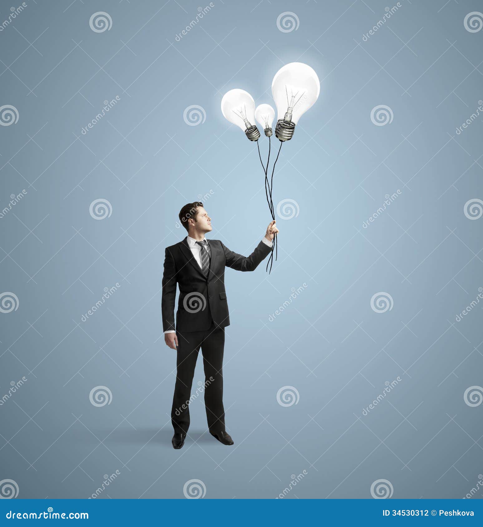 Businessman holding bulbs stock photo. Image of competition 34530312