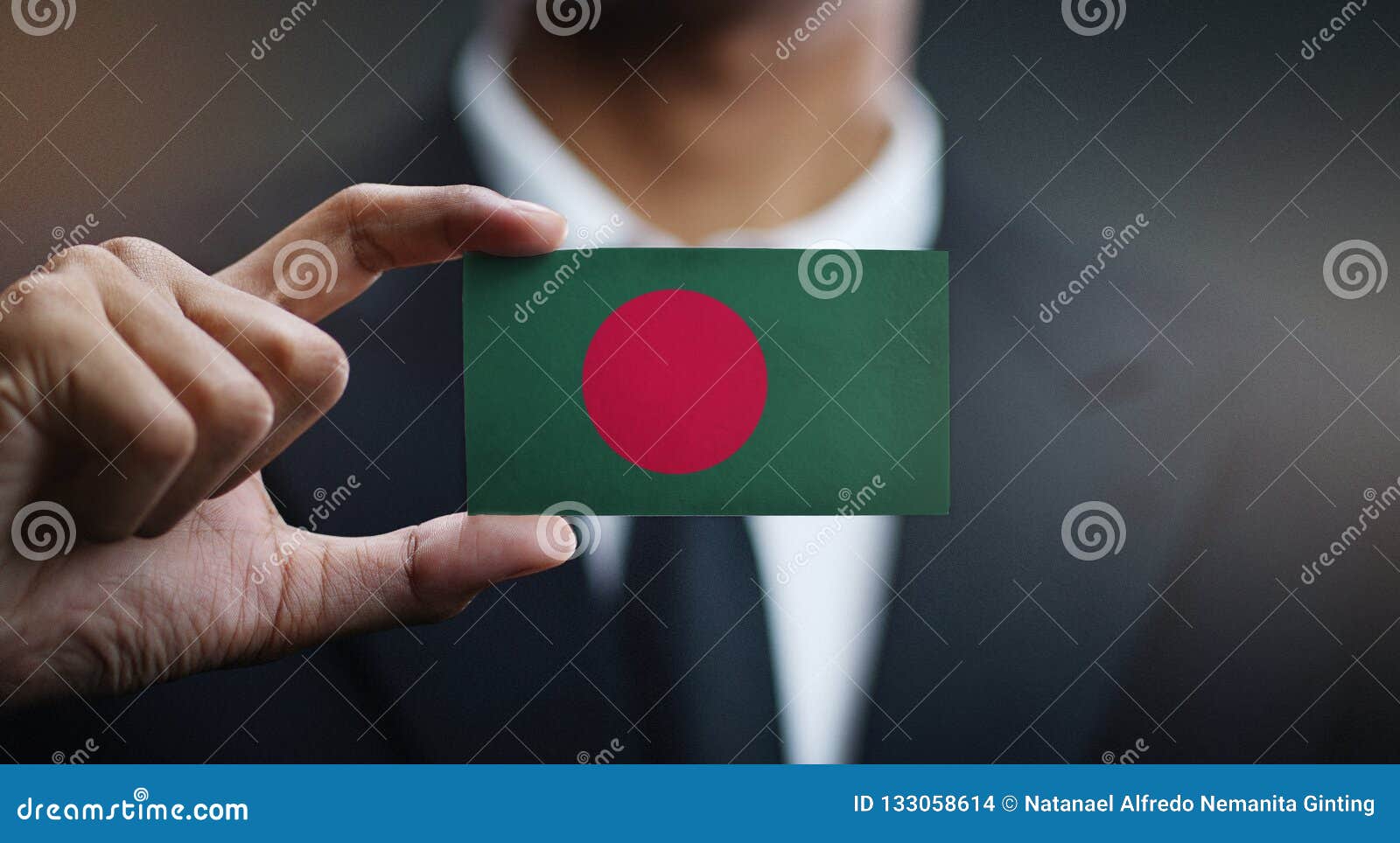 businessman holding card of bangladesh flag