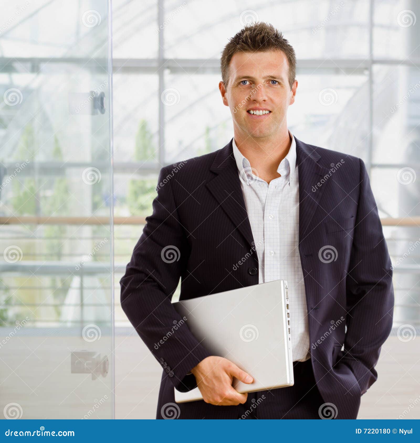 Businessman holding laptop stock photo. Image of businessperson 7220180