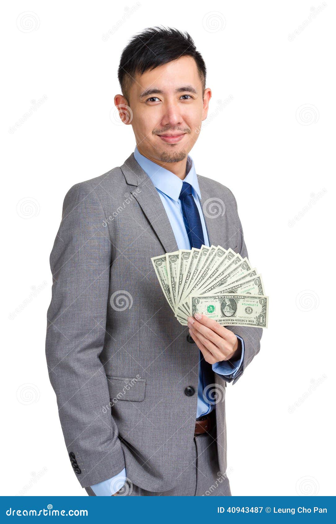 Businessman holding money stock image. Image of currency 40943487
