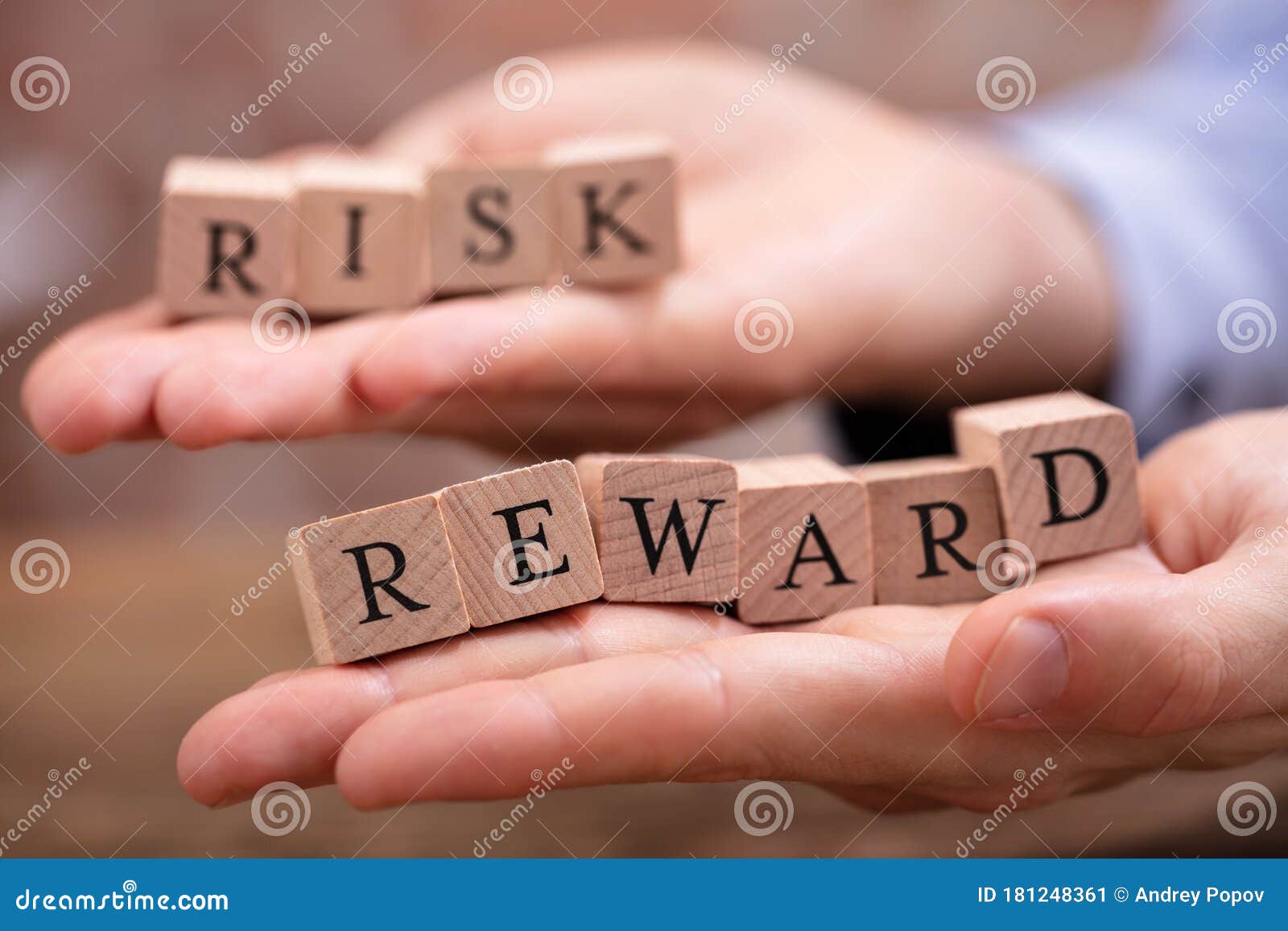 Businessman Holding Risk and Rewards Blocks Stock Image - Image of