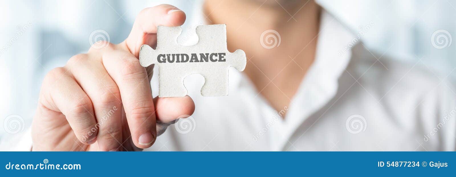 businessman holds puzzle piece with guidance text
