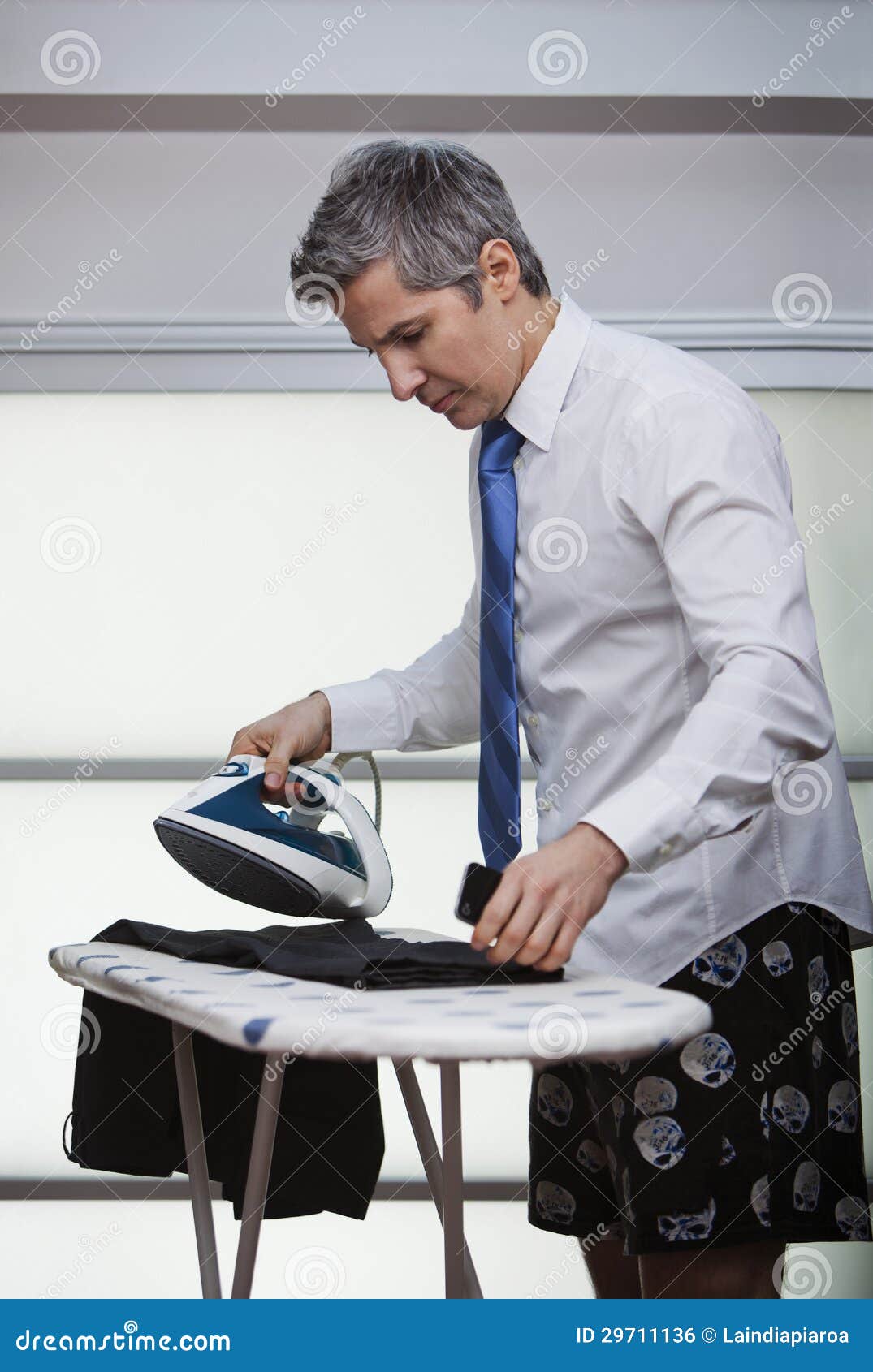 Businessman ironing pants stock photo. Image of person 29711136
