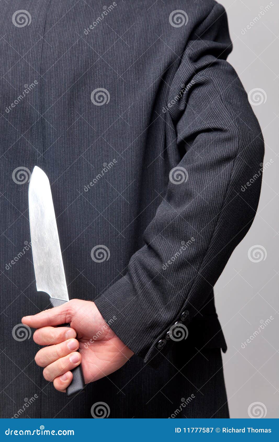 Businessman with a Knife Behind His Back. Stock Image Image of