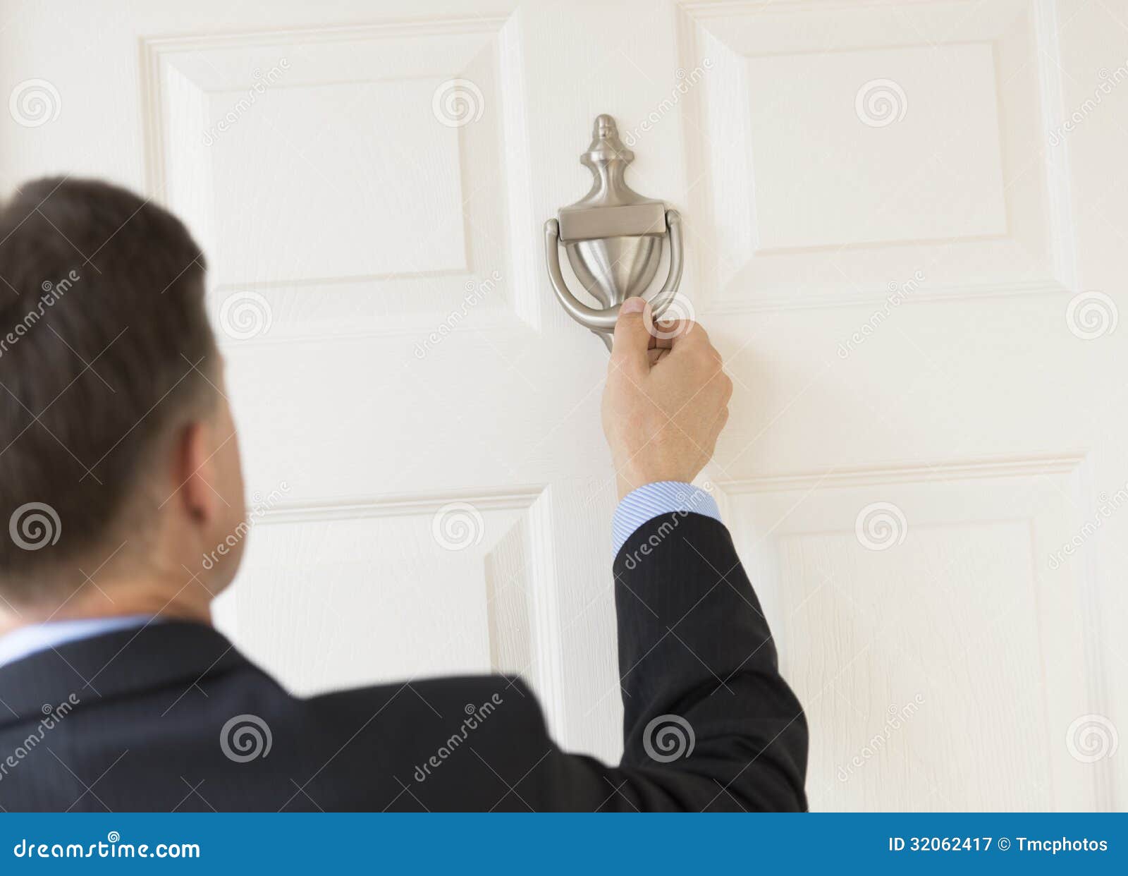 businessman knocking door knocker