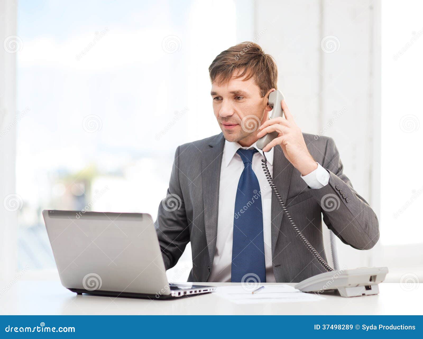 Businessman with Laptop Computer and Phone Stock Image - Image of ...