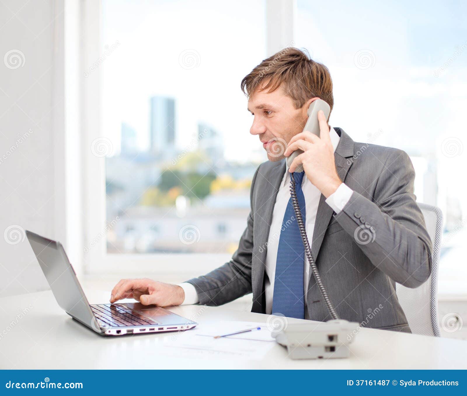 Businessman with Laptop Computer and Phone Stock Image - Image of ...