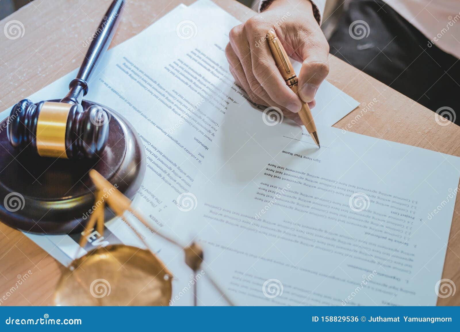 businessman or lawyers sitting office signing contract papers on wood table.