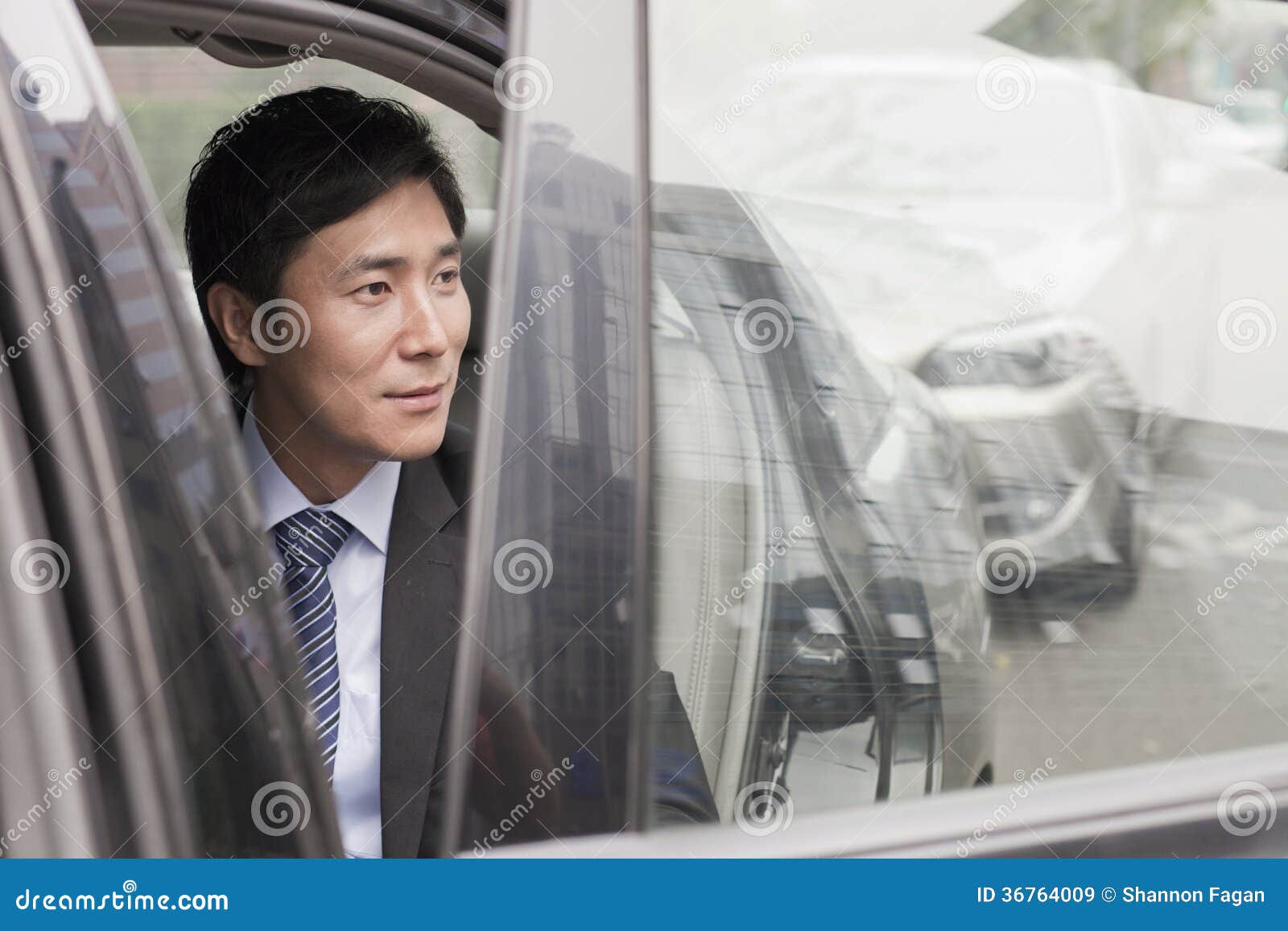 Businessman Leaving Car stock image. Image of chinese 36764009