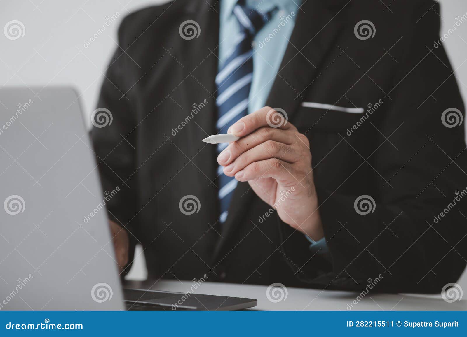 businessman man with laptop, he uses the laptop to view business documents and communicate sending e-mail messages over the