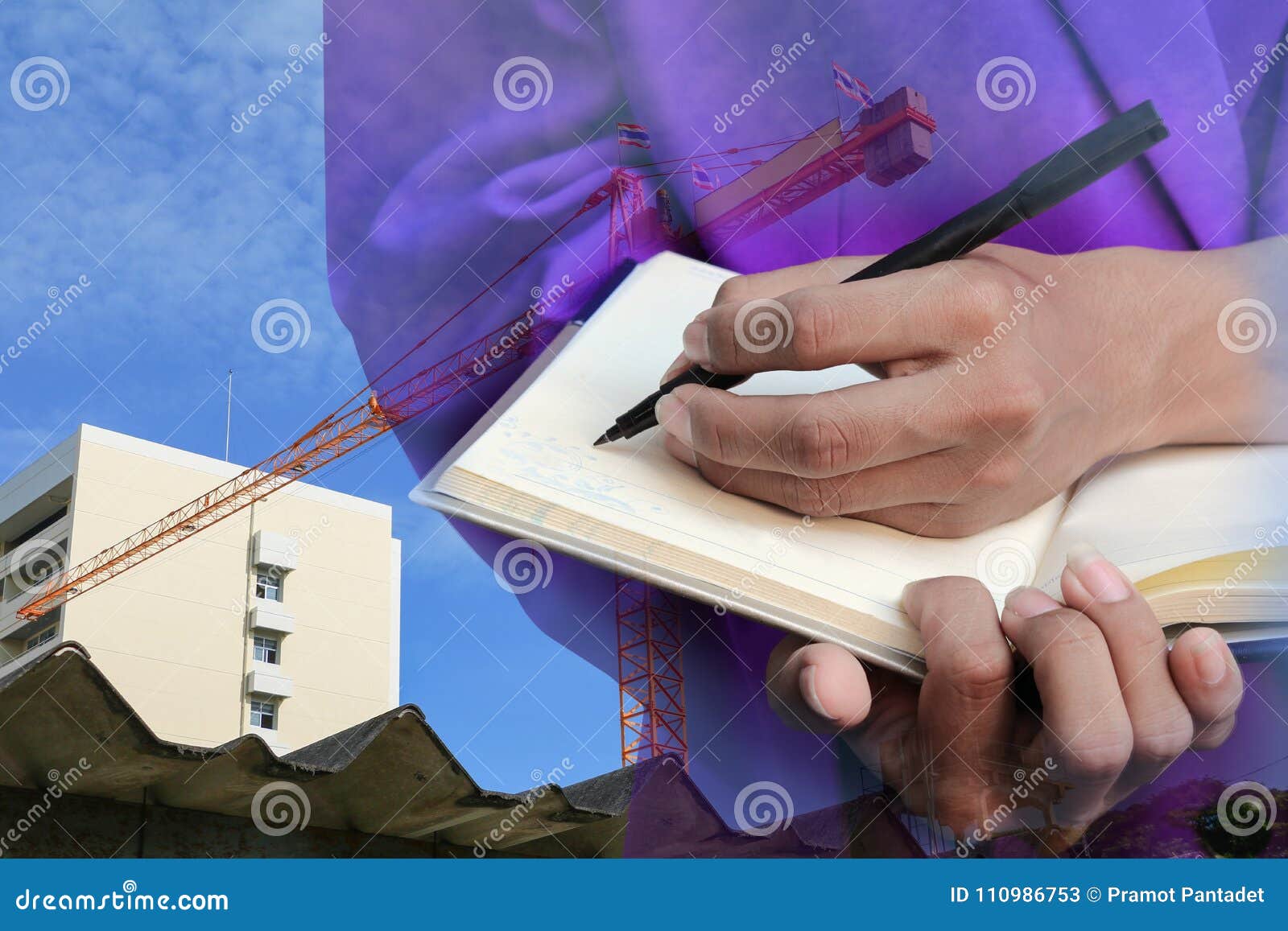 businessman with notepad in hand signing documents in constru