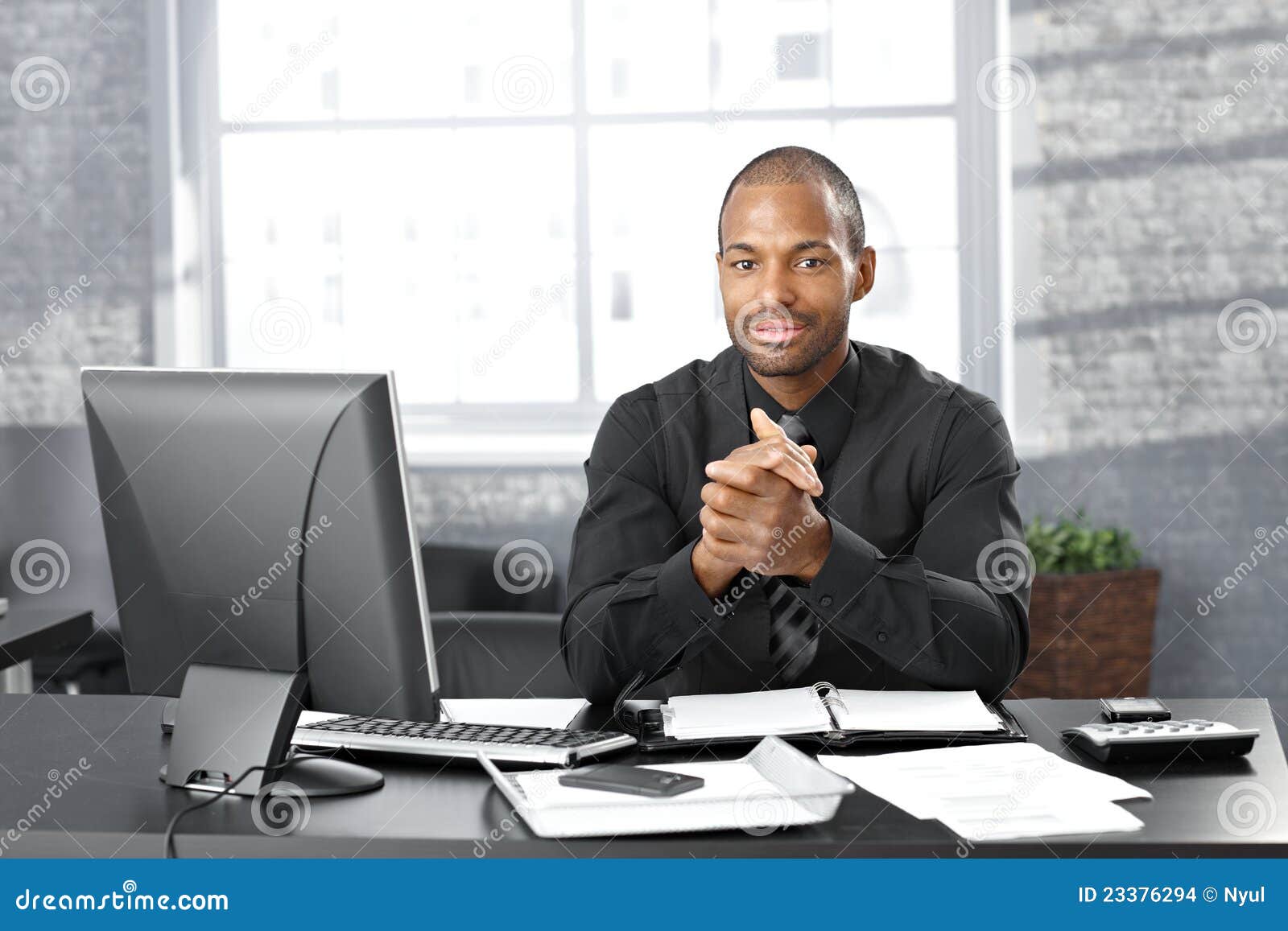 Businessman at office desk stock photo. Image of computer 23376294
