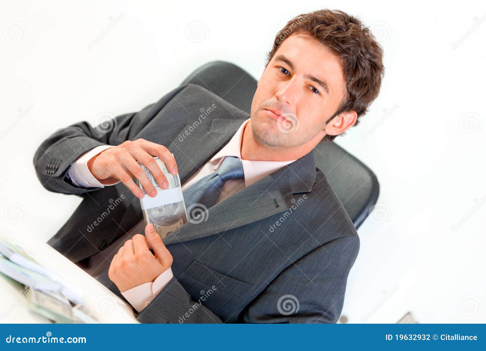 Businessman in Office Putting Money in Pocket Stock Photo Image of
