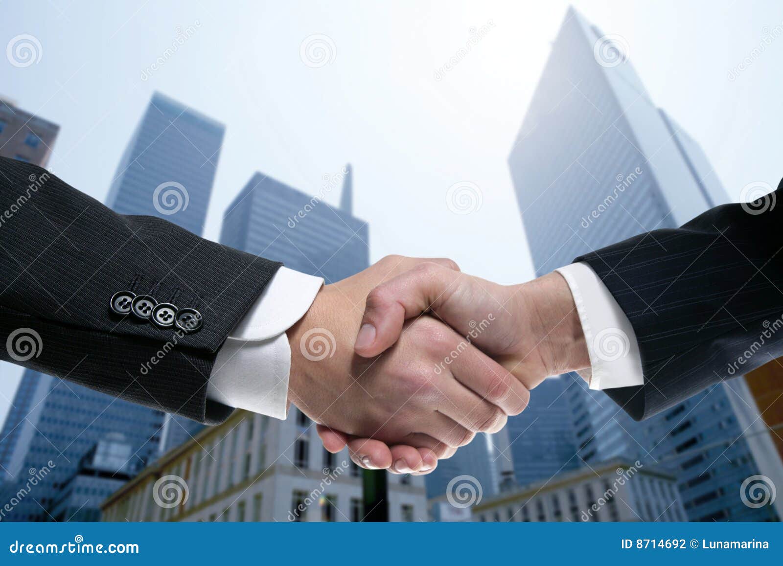 businessman partners shaking hands with suit